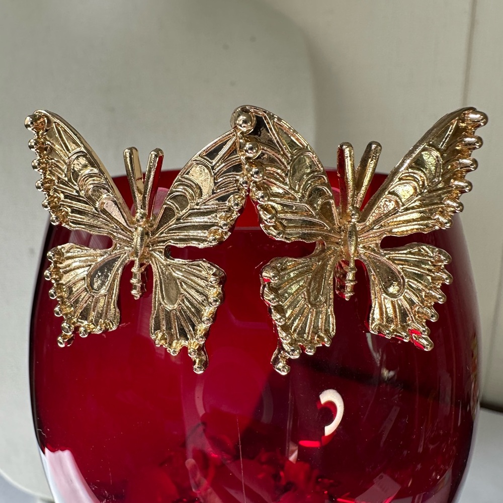 Large embossed design goldtone buttery earrings